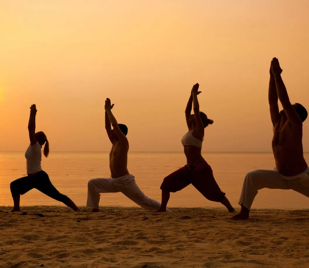 People practicing yoga and meditation for cancer healing