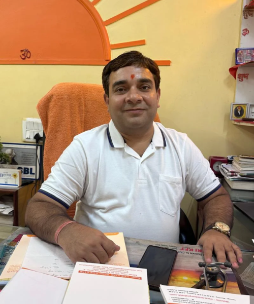 Dr. Ankur Prakash is sitting at his homeopathic clinic.